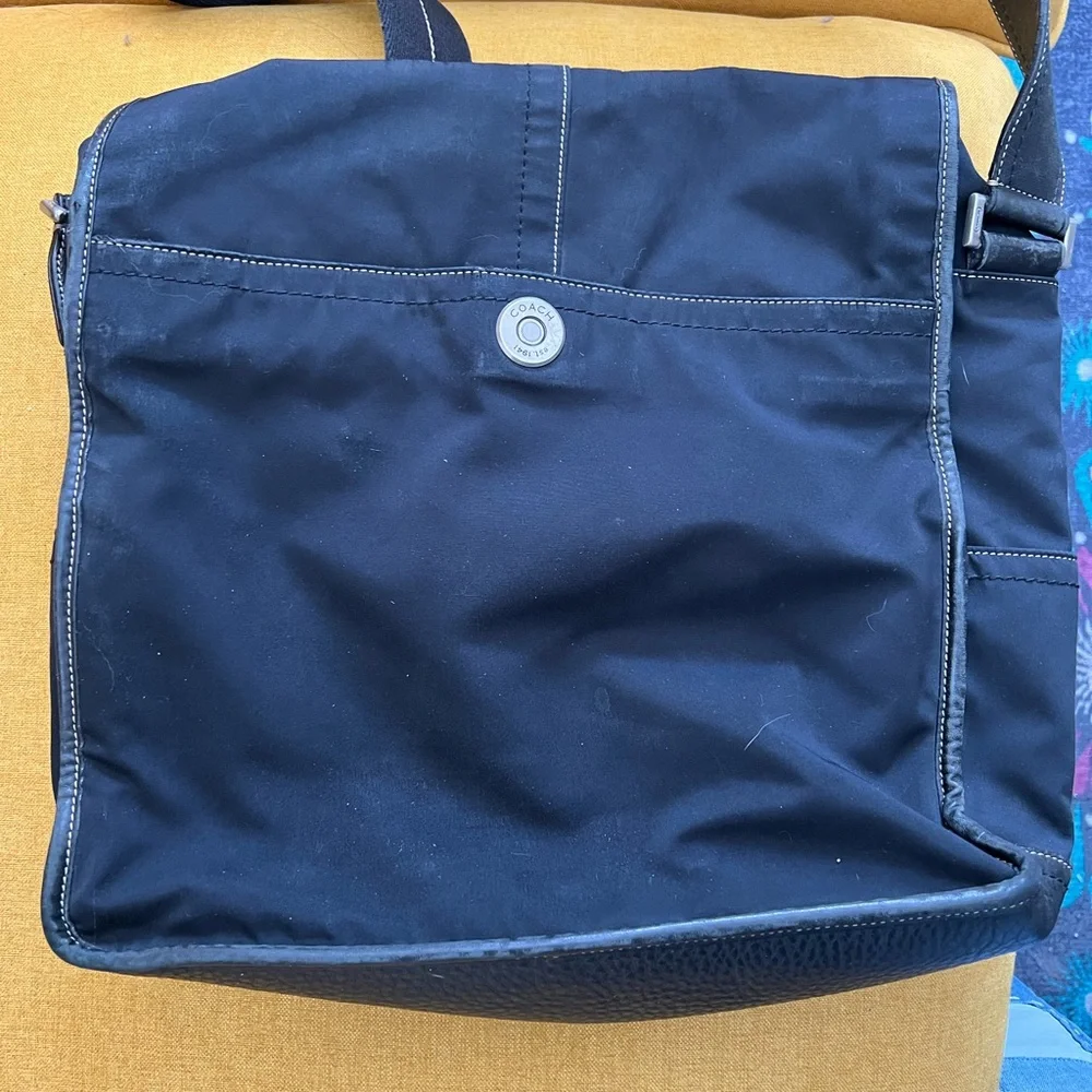 Vintage Coach black nylon leather trimmed flap messenger bag adjustable strap.